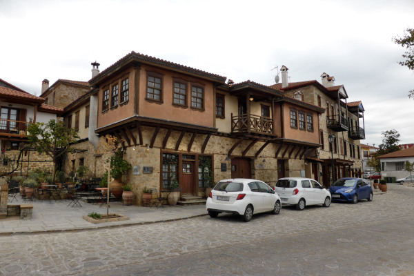 A typical street of Arnaia and houses with the traditional architecture.