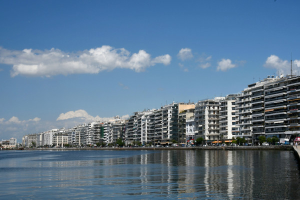 The seafront of Thessaloniki including high residential buildings and the promenade.