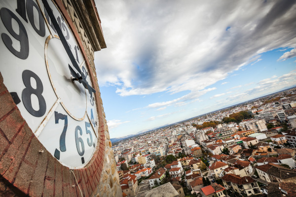 The clock of the Trikala Clock Tower and an overview of the city.