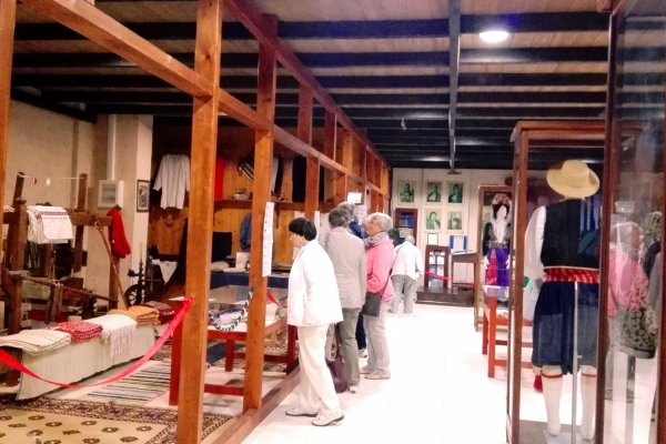 Visitors are looking at the exhibits at the Folklore Museum of Acharavi.