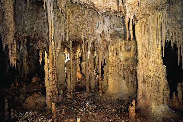 A photo showing plenty of stalagmites and stalactites formations.