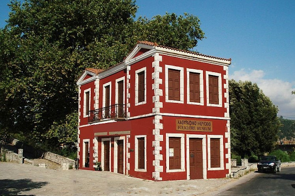 The two-floor red building that hosts the Skoufas Folklore Museum of Arta.