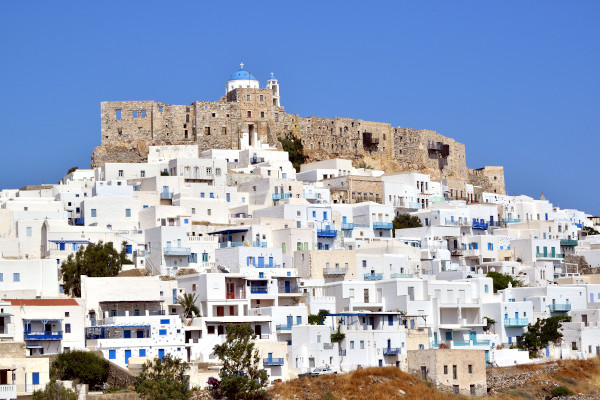 An image showing the Venetian Castle of Astypalaia surrounded by the white houses of the Chora settlement.
