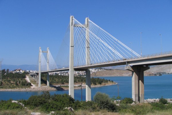 A high bridge with two main pillars and two rows of wire cables on each side at Evripos, Evia.