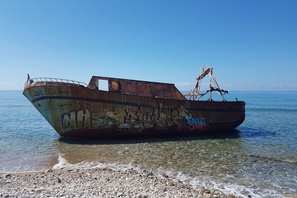 The small boat as it used to be on the Agios Gordios beach.