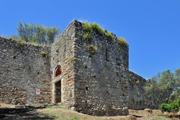 A tower, the walls, and a restored entrance to the Byzantine Fortress of Gardiki.