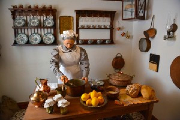 A robotic female figure in a cooking scene at the Casa Parlante Museum of Corfu.
