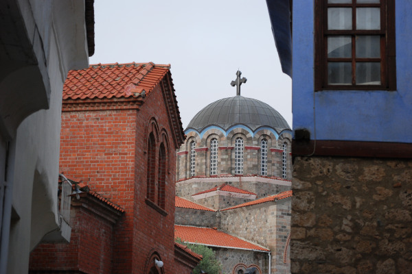 A church dome between buildings in the district of Varosi in Edessa.