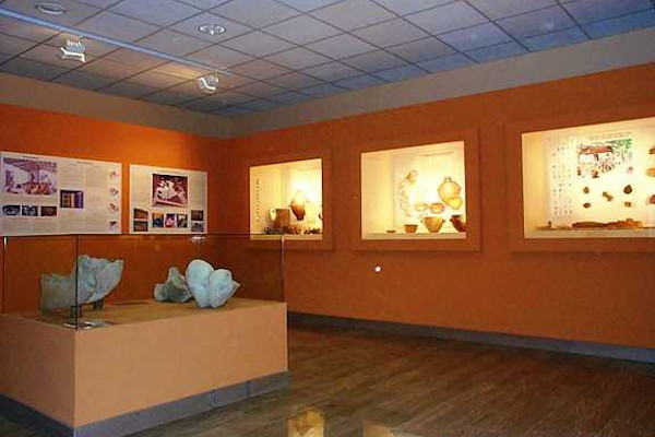 One of the rooms of the Archaeological Museum of Florina with many exhibits in displays.