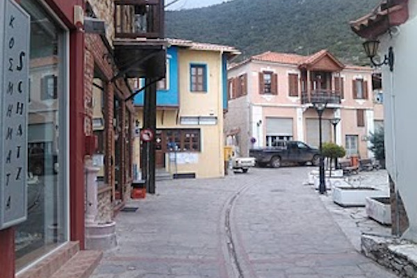 A central street of the village of Galatista with shops and other traditional buildings.