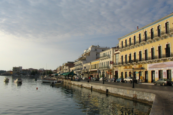 A picture of the Seafront Promenade and Port of Gytheio by old-style buildings.