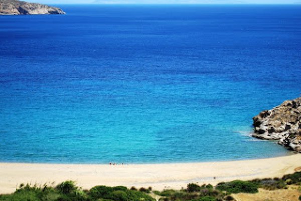 A panoramic picture of Kalamos Beach of Ios with all shades of blue and golden sand.
