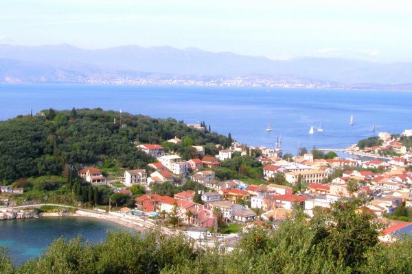 A picture of Kassiopi village and Kalamionas beach taken from a hill.