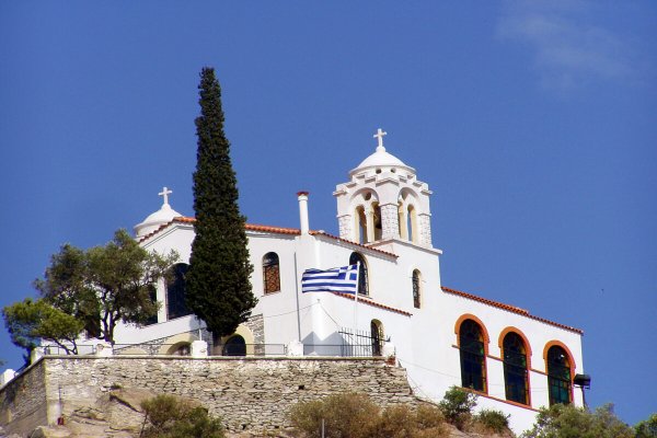 Kavala's Prophet Elias white church in a blue-sky backdrop.