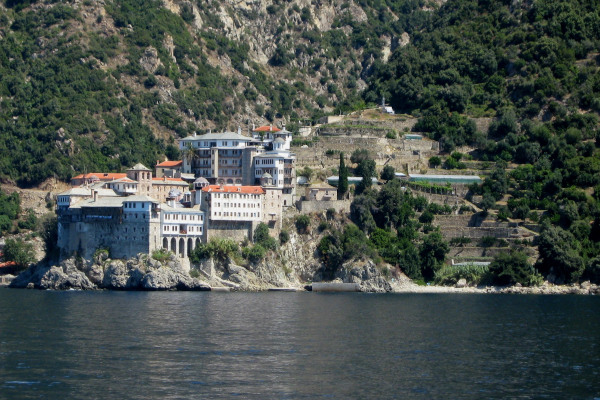 A view of Osiou Gregoriou Monastery built on a rock by the sea.