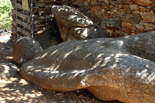 The Kouros of Naxos in Flerio lying on the ground out of a field.