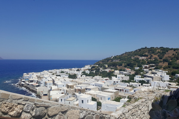 An overview of the Mandraki settlement in Nisyros with the blue of the Aegean in the background.