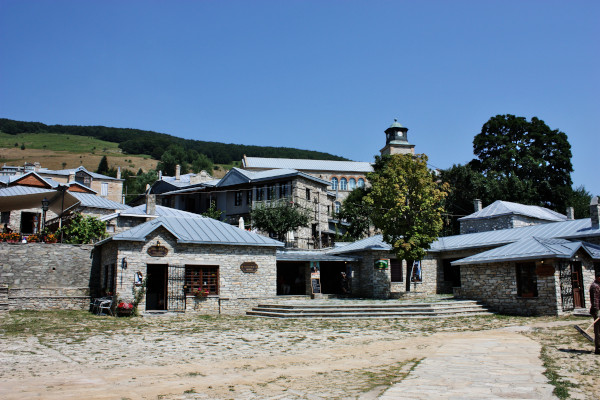 The central square of the village surrounded by traditional stone-built houses.