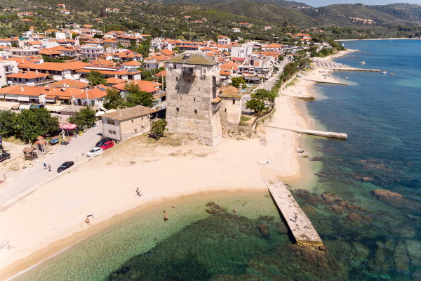 An aerial image showing Ouranoupolis Beach as well as a part of the homonymous settlement.