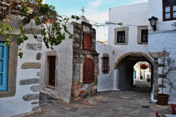 A picture taken in one of the streets in the Chora of Patmos among the traditional buildings.