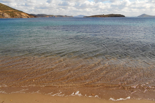 A photo showing the clear waters of the Psili Ammos Beach on Patmos island.