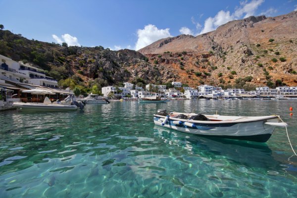 A picture showing the boats and the coastal settlement of Loutro, Chania.