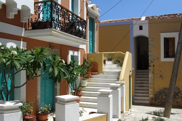 One of the buildings in the town of Symi with traditional architecture and colors.