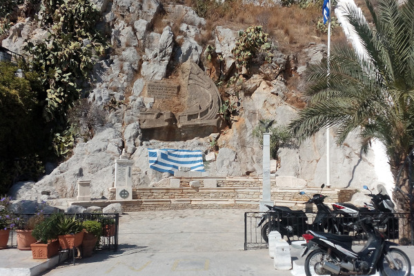 A picture showing the carved War Memorial at the Symi Harbour.