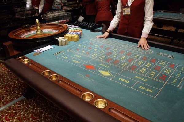 A roulette table and a dealer in the Regency Casino of Thessaloniki.