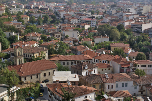 An overview of the old city of Trikala including a church and numerous old mansions.