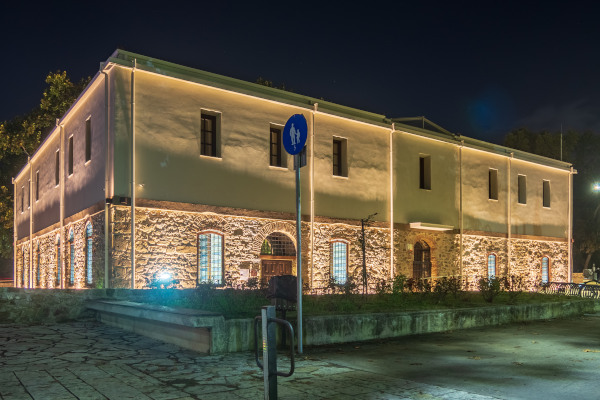 The enlightened exterior of Vassilis Tsitsanis Museum (Old Prison) during the night.